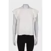 T-shirt with embossed pattern and tag