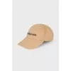 Beige cap with tag