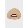 Beige cap with tag