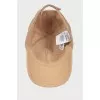 Beige cap with tag