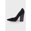 Suede shoes are decorated with rhinestones
