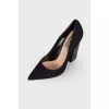 Suede shoes are decorated with rhinestones
