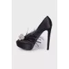 Textile shoes with rhinestones and feathers