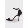 Black sandals with a flower