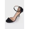 Black sandals with a flower