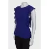 Топ із оборками приталеного силуету
