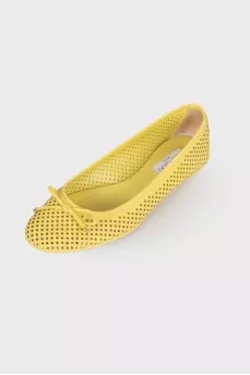 Yellow perforated ballerina shoes