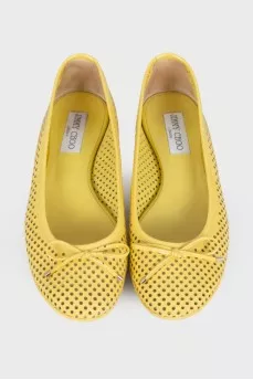 Yellow perforated ballerina shoes