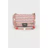 Textile bag with medallions on the strap