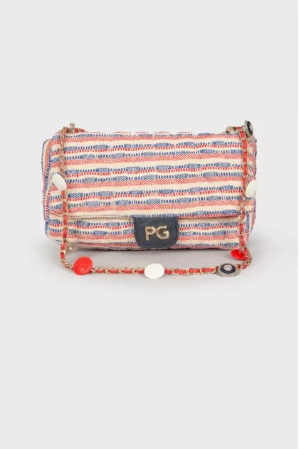 Textile bag with medallions on the strap