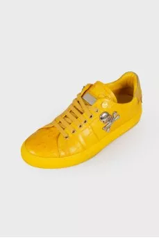 Yellow metal skull sneakers