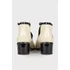 Peep-toe patent leather boots