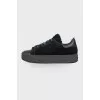 Black lace-up sneakers