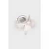 White accessory in the shape of a flower