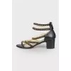 Leather sandals with gold chains