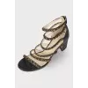 Leather sandals with gold chains