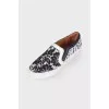 Black and white lace slip-ons