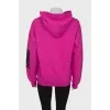 Pink sweatshirt with print and tag
