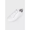 Patent sneakers with brand logo