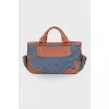 Denim bag with leather trim