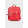 Red backpack with silver hardware