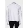 White sweatshirt with appliqué