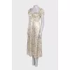 Dress with ruffles and a slit at the hem