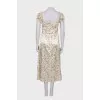 Dress with ruffles and a slit at the hem