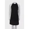 Black dress with ties and pearls