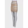 Beige skirt with brand print