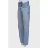 Jeans with asymmetric fastening