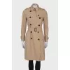 Beige double-breasted trench coat