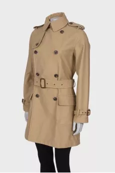 Beige trench coat with pockets