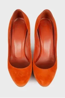 Orange suede pumps