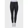 Black eco-leather trousers with tag