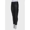 Black eco-leather trousers with tag
