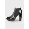 Perforated patent leather ankle boots