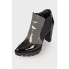 Perforated patent leather ankle boots