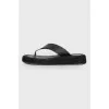 Black leather slippers