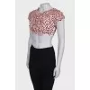 Top with ruffles and print