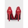 Red snakeskin embossed shoes