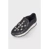 Black sneakers with perforations and rhinestones