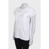 White T-shirt with golden buttons