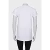 White T-shirt with golden buttons