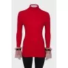 Golf with lace ruffles on the cuffs