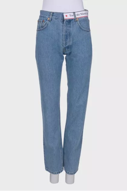 Blue jeans with brand logo