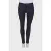 Navy blue jeans with a zip at the bottom