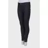 Navy blue jeans with a zip at the bottom