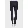 Navy blue jeans with a zip at the bottom