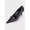 Black pointy-toe shoes